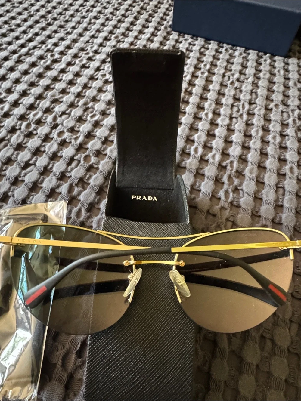Prada Gold Frame Sunglasses with Orange-Red Mirrored Lenses